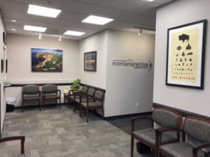 A waiting room with chairs and tables in it